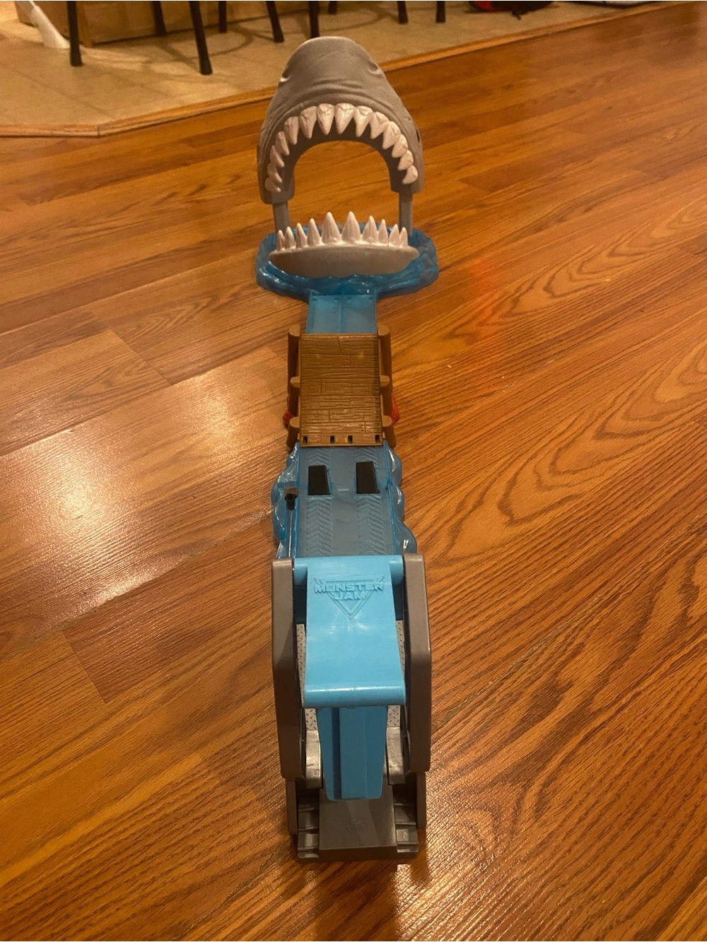 Monster Jam Megalodon Mayhem Stunt Set with a shark head obstacle